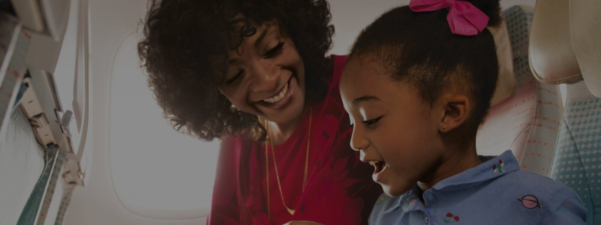 A smiling woman talking to excited girl | emirates hotels