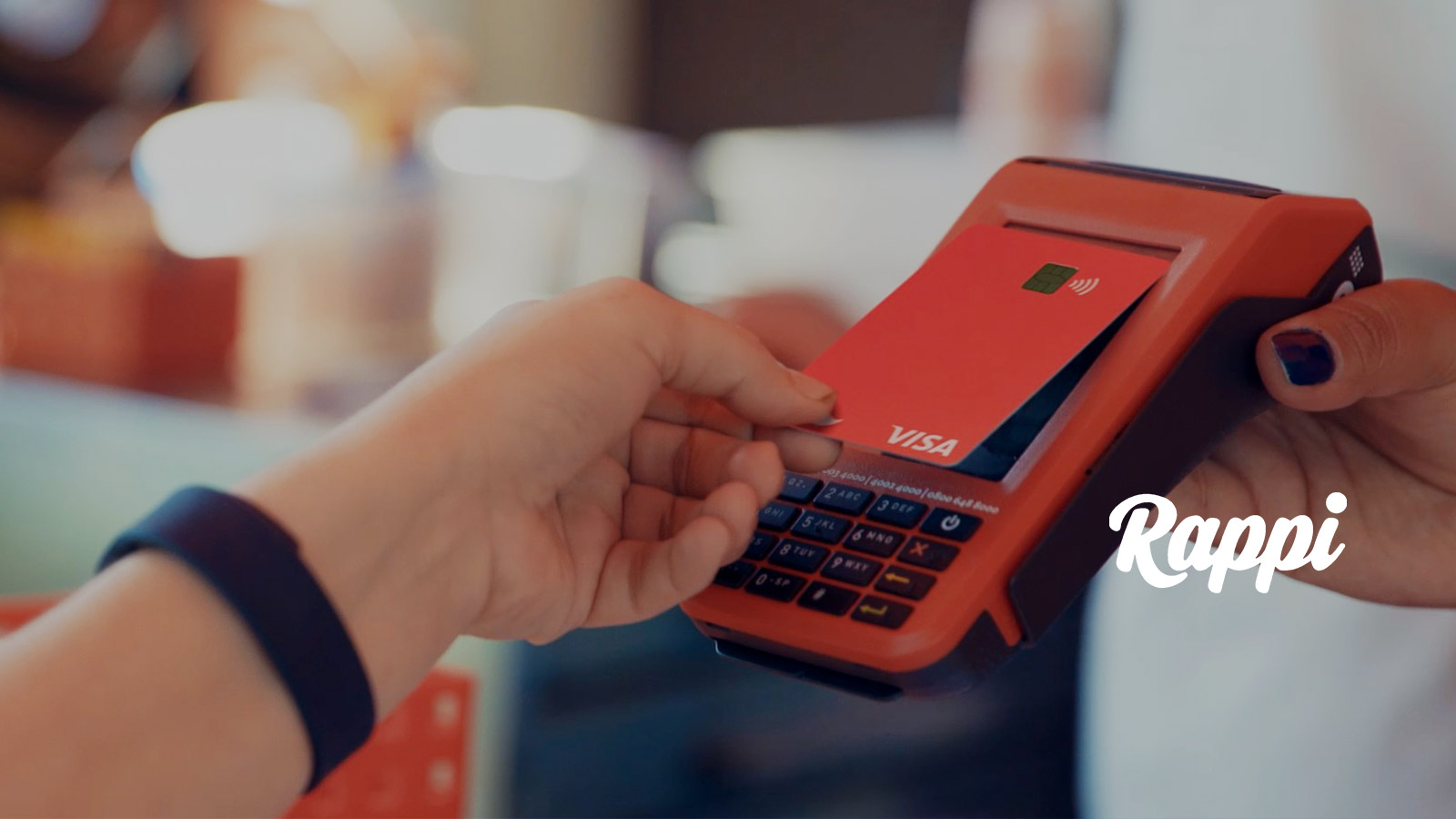 Person using Rappi card at point-of-sale.